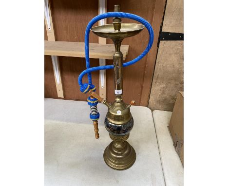 A BRASS SHISHA PIPE WITH A BLUE BRAIDED PIPE 