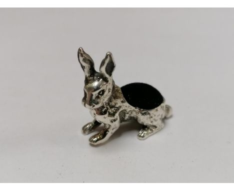 A MINIATURE .925 SILVER RABBIT PIN CUSHION 