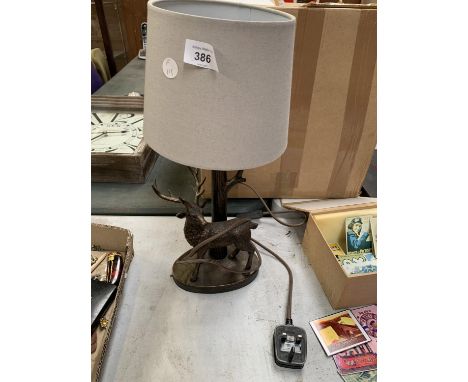 A TABLE LAMP WITH STAG DECORATION 