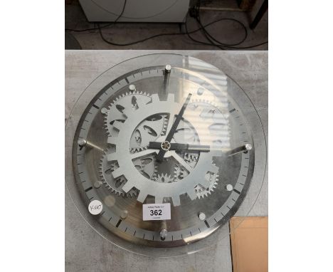 AN UNUSUAL SILVER COLOURED CLOCK SHOWING COG WORKINGS 30 CM DIAMETER 