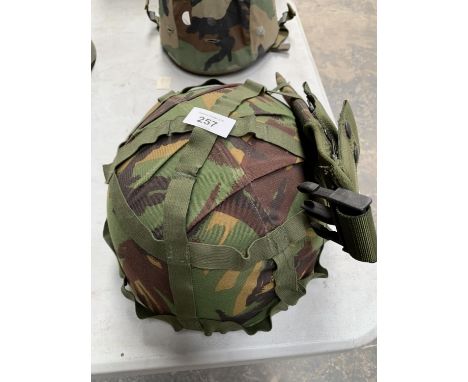 A PARACHUTIST LIGHTWEIGHT BRITISH HELMET AND BAYONET POUCH 