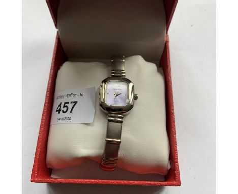 A BOXED LADIES SEKONDA WATCH WITH SQUARE SILVER METAL FRAMED FACE IN WORKING ORDER 