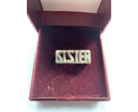 A BOXED SILVER 'SISTER' RING 