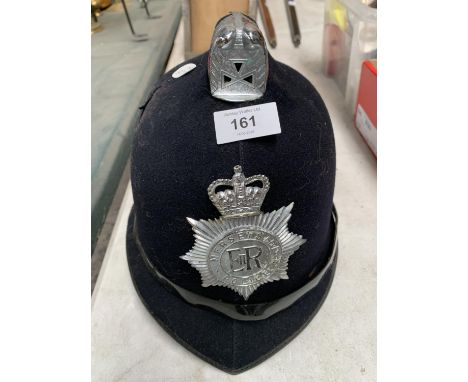 A POLICE HELMET WITH MERSEYSIDE BADGE 