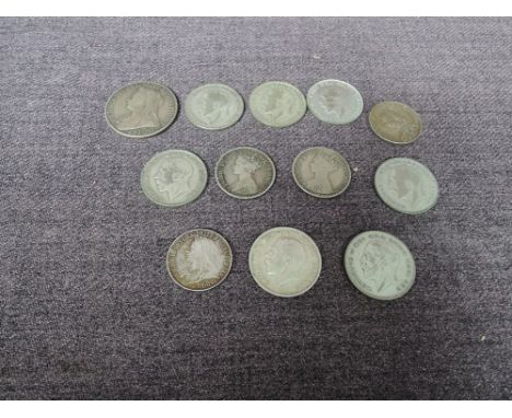 Twelve GB Silver Coins, 1900 Crown, 1915, 1923, 1924, 1925 x2, 1926 and 1927 Half Crowns, 1859, 1865, 1887 and 1893 Florins