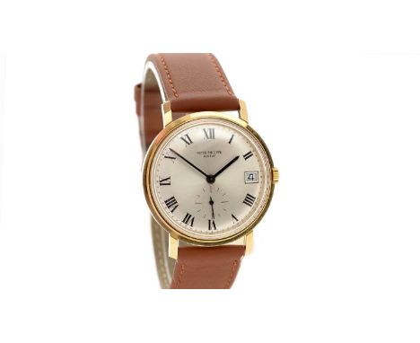Patek Philippe, Geneve: an 18ct yellow gold-cased automatic wristwatch, ref 3445 serial no. 328***, the silvered roman dial w
