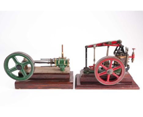 An engineer built a live steam beam engine. With a wooden jacketed cylinder and large flywheel on a mahogany base. 28 cm long