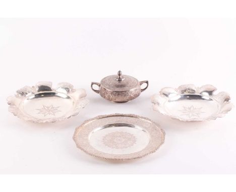 An early 20th century possibly Iranian white metal two-handled covered bowl and matching plate both decorated with Arabesque 