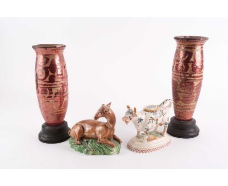 A near pair of 19th century Continental ruby-lustre decorated vases, mounted in wooden bases, 28 cm high, both a/f, together 