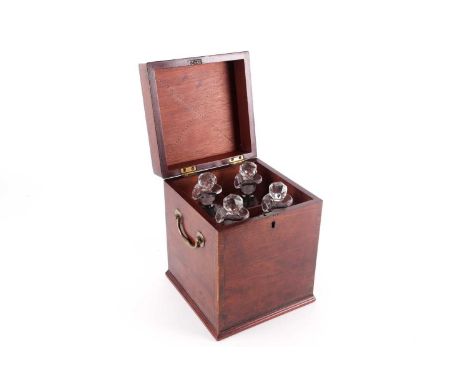 A Regency mahogany and inlaid table decanter box, the hinged cover opening to reveal a four-section interior with conforming 