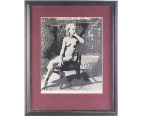 Bill Brandt (1904-1983) British, a seated female nude, 1950s, gelatin silver print, signed to lower margin, 35 cm x 29 cm fra