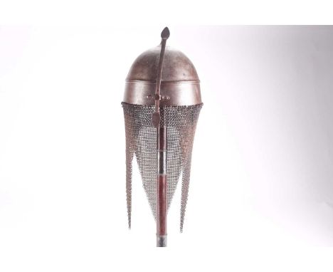 A probably 19th century Persian or Indian Khula Khud steel helmet with short spear finial girdled body and adjustable nose gu
