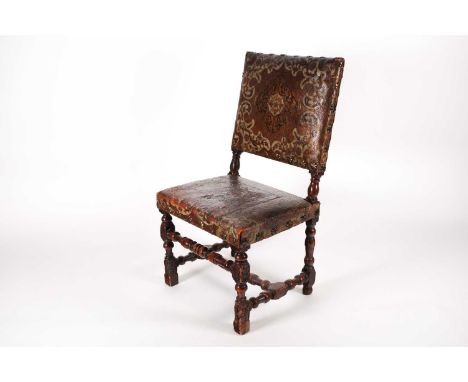 A late 17th century walnut "Farthingale" type side chair with decorative studded stuff over "Portugese-Worked" hide upholster