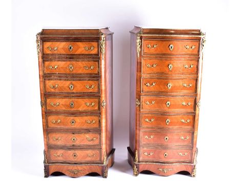 A pair of Louis XV style Kingwood serpentine escritoire semainiers. With white marble caddy tops, tulipwood banding and gilt 