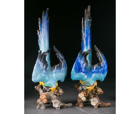 Two large 20th century Hutschenreuther Kunstabteilung German ceramic figures of parrots, decorated in polychrome enamels on a
