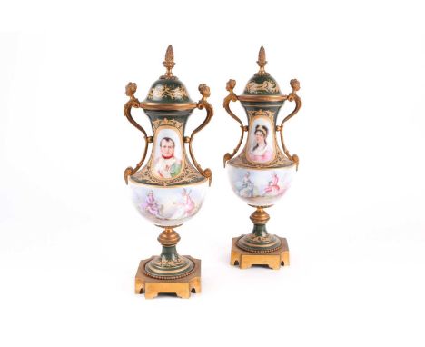 A pair of Chateau de Tuileries Sevres porcelain and ormolu two-handled urn-shaped vases and covers, on shaped square bases, h