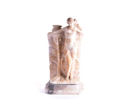 A carved alabaster lamp base, modelled as an art nouveau style maiden beside a fountain (lacking lamp fittings), on an associ