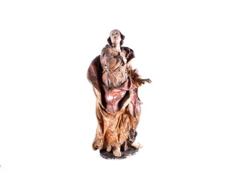 A 16th century late Baroque, probably Southern German or Spanish, limewood figure of a saint, dressed in flowing robes with o