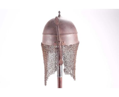 A probably 19th century Persian or Indian Khula Khud steel helmet with short spear finial girdled body and adjustable nose gu