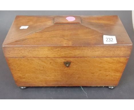 A 19th Century rosewood tea caddy of sarcophagus form with twin scallop shell carved lugg handles, the hinged top revealing t