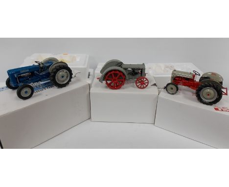Three modern Ford models, boxed, including 1927 Fordson F tractor 1952 Ford 8M tractor and a 1962 Ford 2000 tractor.