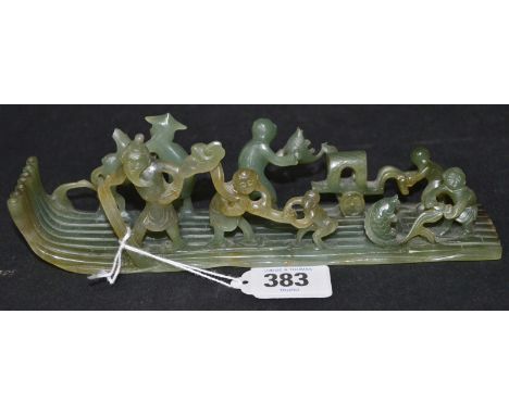 Chinese green jade carving of a bamboo boat with eight various figures, length 8".