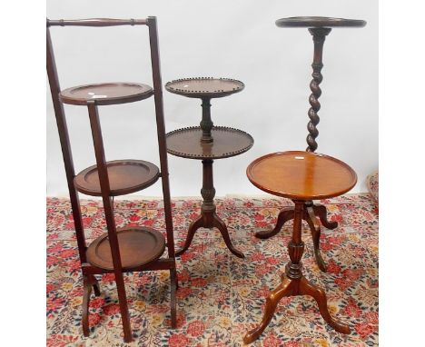 Mahogany three tier folding cake stand, together with a barley twist plant stand, two tier tripod table and a tripod wine tab