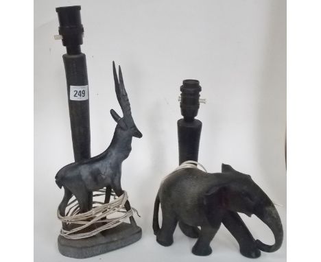 Two African pre war ebony carved table lamps, one with an elephant, the other an antelope, with brown Bakelite light fitments