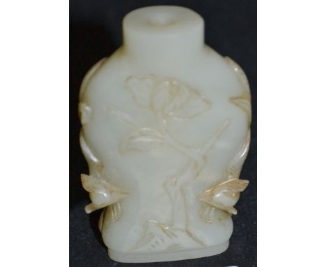 Chinese green jade snuff bottle of flattened baluster form carved to the sides with two exotic birds flanking a branch, heigh