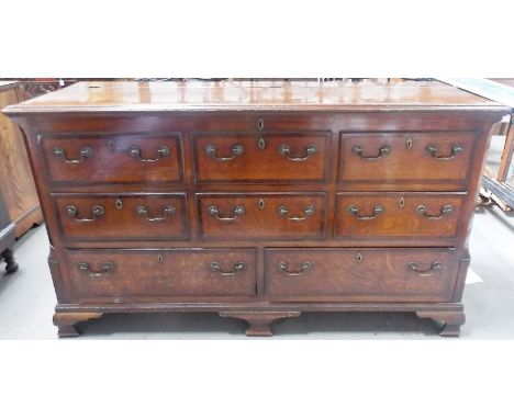George III oak cross banded Cheshire/Lancashire mule chest, the top with moulded edge hinged to reveal an open recess, to the