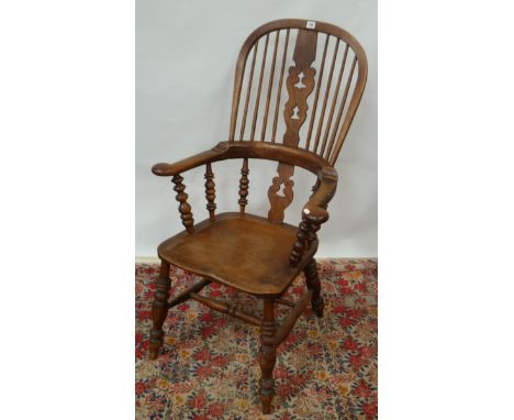 19th Century elm and yew Windsor armchair, the hoop and stick back with a shaped and pierced splat over the three frieze scro