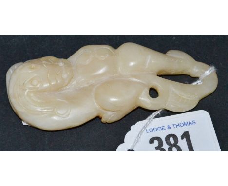 A Chinese white and russet jade carving, possibly a belt buckle, width 3.25".