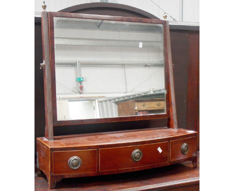 19th Century mahogany bow front swing toilet mirror with reeded supports and brass urn finials, the boxwood strung base with 