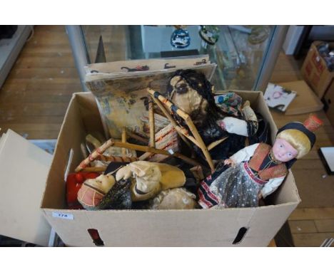 A mixed lot of vintage cloth dolls and Louis Wain prints.