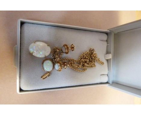 An opal and 9ct gold suite, to include; a cabochon opal pendant and chain, claw set, a pair of opal cluster ear studs, an opa