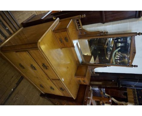 A good quality light oak possibly ash mirrored back dressing table having an assorted of four drawers.