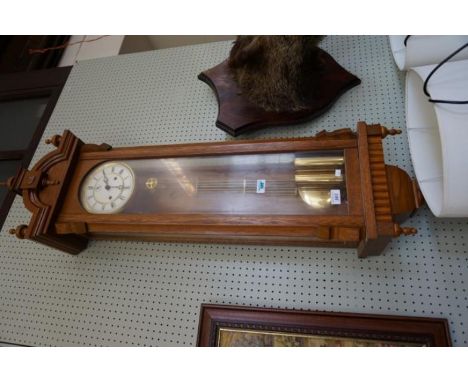 A mid 20th Century light oak cased German wall clock.