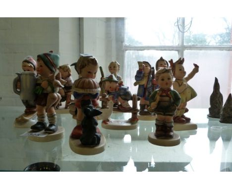 A collection of eleven assorted Goebel Hummel figurines.