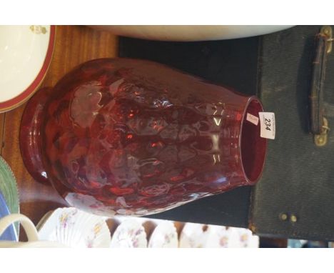 A large size cranberry glass light shade.