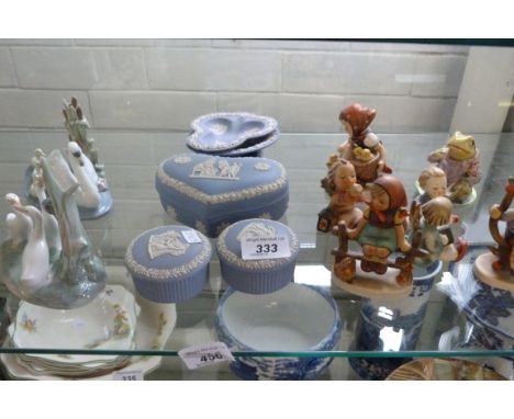 A mixed lot to include two Nao models of geese and swans, Wedgwood blue jasperware, Goebal figures etc.