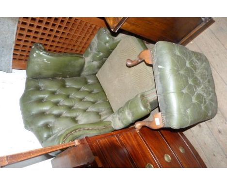 A Chesterfield green leather button back armchair and matching footstool (af).