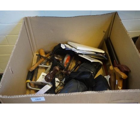 A mixed lot of vintage tools and cameras.
