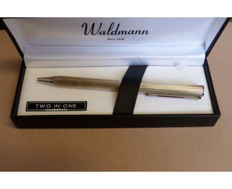 A silver pen by Waldmann With engine turned style decoration, cased