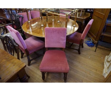 A set of six Victorian oak dining chairs 
Each of solid construction and featuring upholstered padded back panels incorporati