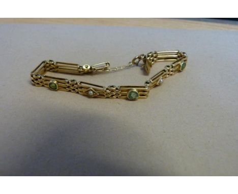 A half pearl and green stone gate-link bracelet, the yellow metal links set with alternating pearl and faceted green stones, 