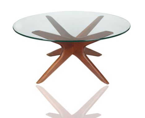 with sculpted wooden base with circular glass top; height: 40 cm (15 3/4 in.), diameter: 91.5 cm (36 in.)CONDITIONThe table i