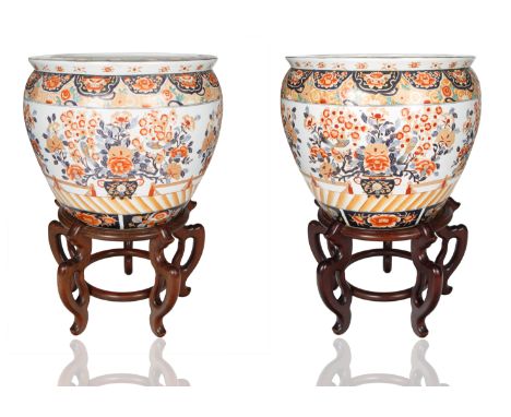 round squat form the body of each with red, cream and blue ground with intricate and ornate floral and foliate motif, the int