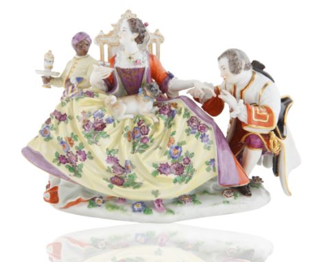 modelled after J.J. Kaendler, on a mound moulded base with applied flowers, seated a crinoline lady with applied jewelry, flo