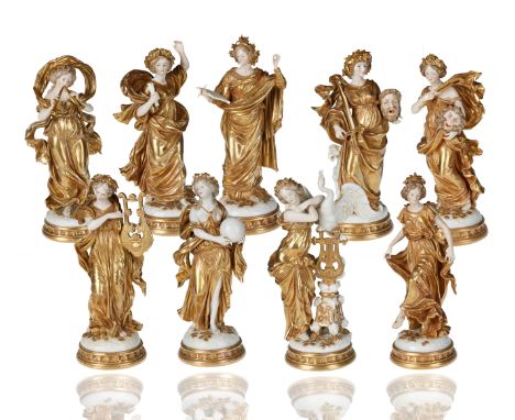the group standing upright, on individual mound moulded bases with gilt applied foliage and rosettes, each Muse dressed in a 