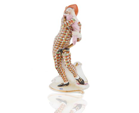 modelled after Franz Anton Bustelli, based on Italian Commedia dell'Arte 'Pulcinella Figure', on a gilt-edged, scroll moulded